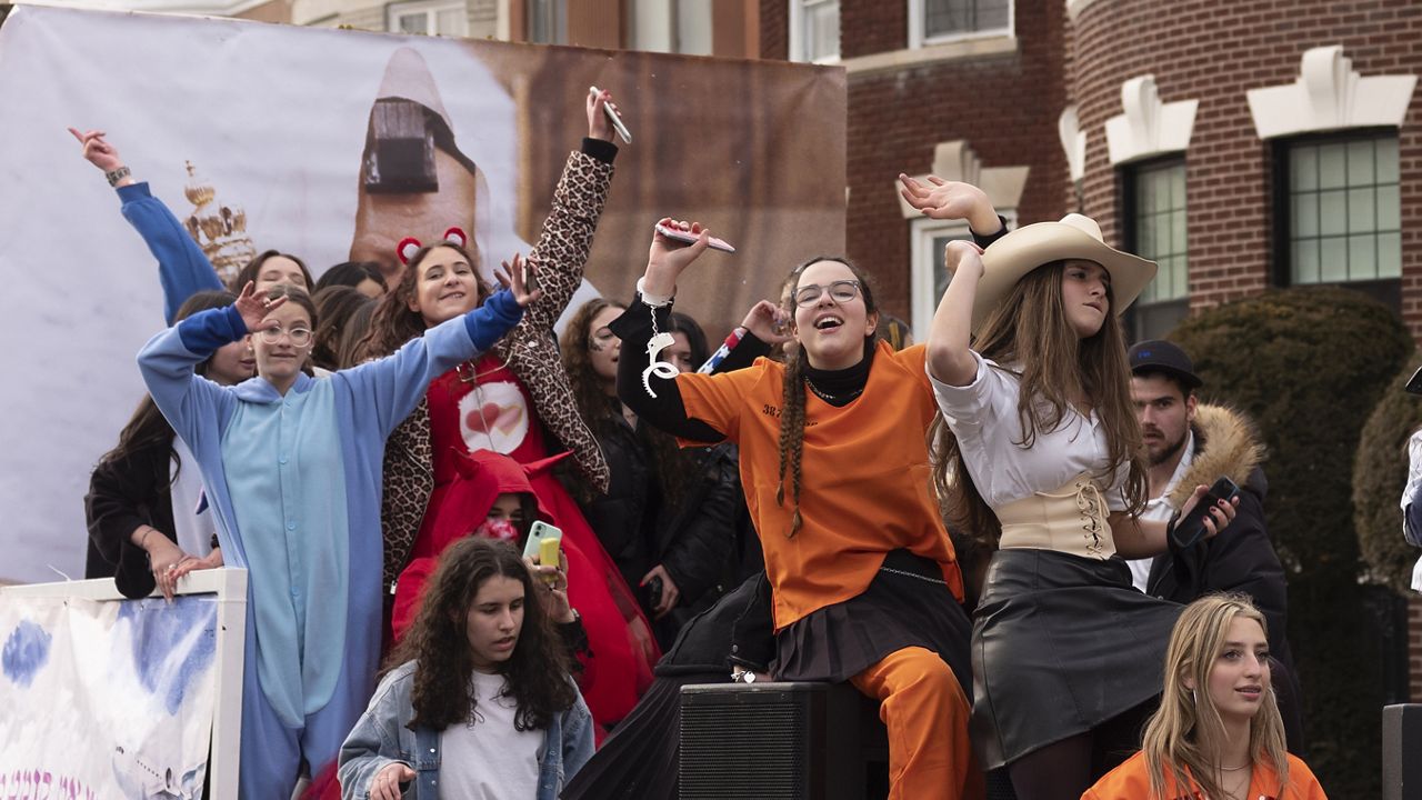 Girls dance to music for Purim on Friday, Feb. 26, 2021 in the Crown Heights neighborhood of New York.
