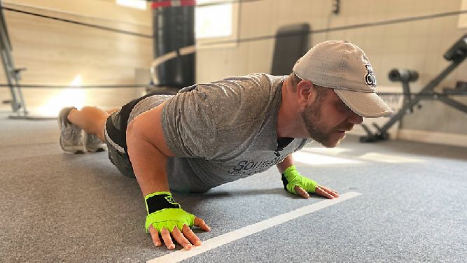TShane Johnson training for push-up challenge.