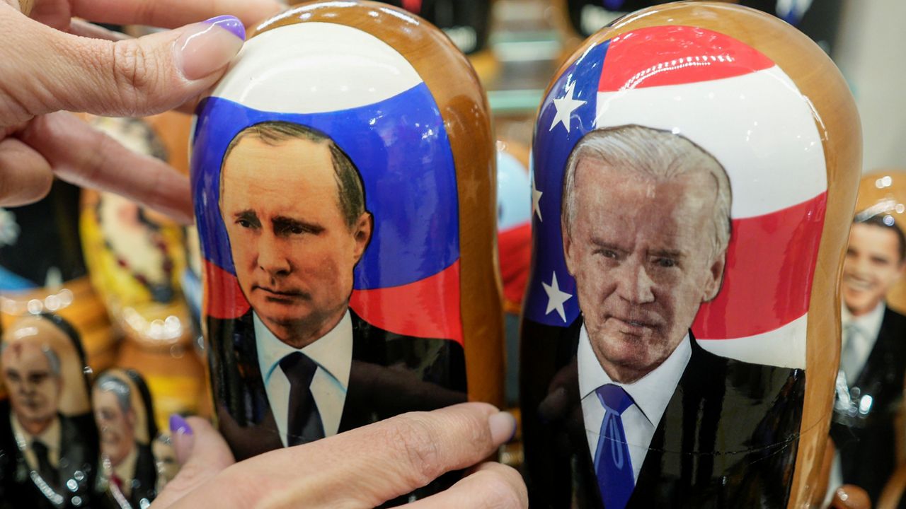 President Joe Biden, shown here on a Russian doll on the right, has warned Russian President Vladimir Putin, left, of harsher economic consequences should Moscow launch an attack on Ukraine. (AP Photo)