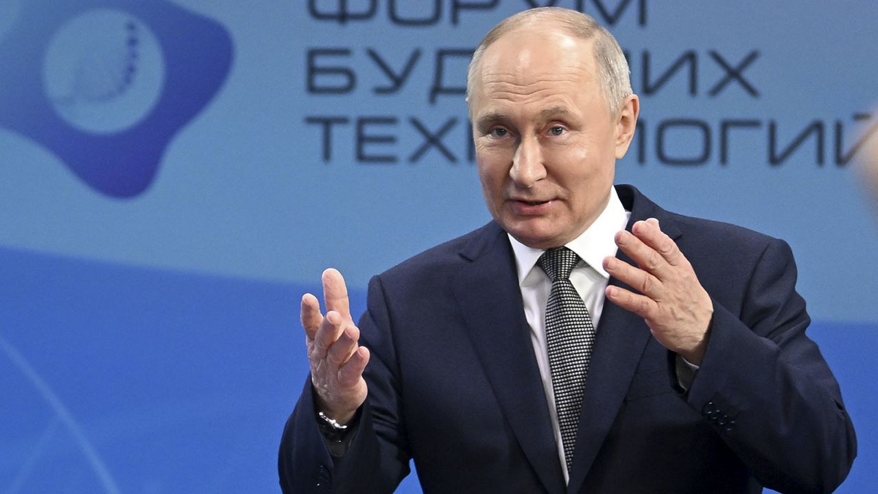 Russian President Vladimir Putin gestures as he speaks to scientists on the sidelines of the Future Technologies Forum at the World Trade Centre in Moscow, Russia, Wednesday, Feb. 14, 2024. (Kristina Kormilitsyna, Sputnik, Kremlin Pool Photo via AP)