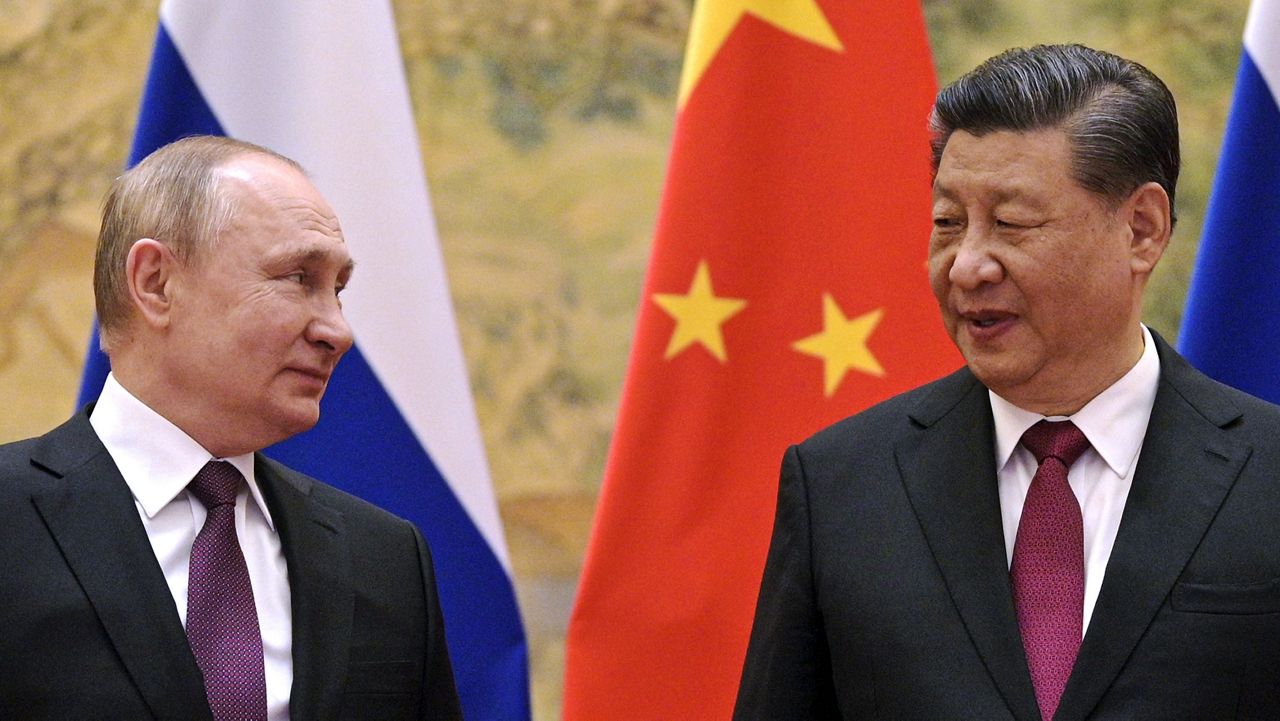 Chinese President Xi Jinping, right, and Russian President Vladimir Putin talk to each other during their meeting in Beijing, China on Feb. 4, 2022. (Alexei Druzhinin, Sputnik, Kremlin Pool Photo via AP)