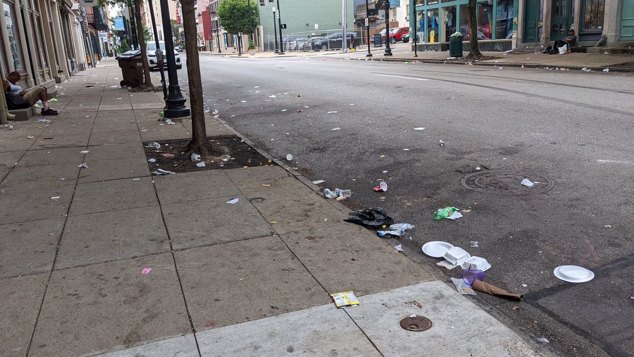 A stretch of Main Street in Over-the-Rhine the Sunday morning following the busiest night of Cincinnati Music Festival. Discarded foot containers and empty alcohol containers littered the street. (Photo courtesy of Scott Griffith)
