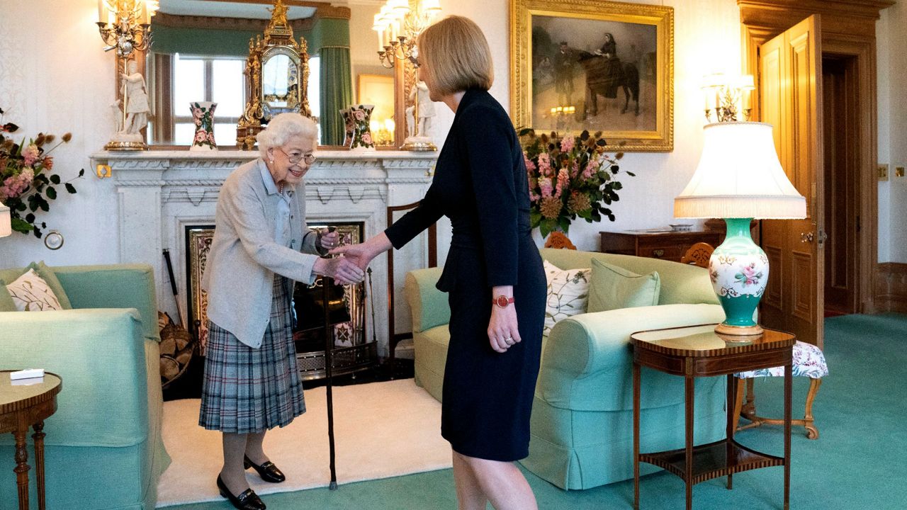 Britain's Queen Elizabeth II, left, welcomes Liz Truss during an audience Tuesday at Balmoral, Scotland, where she invited the newly elected leader of the Conservative Party to become prime minister and form a new government. (Jane Barlow/Pool Photo via AP)