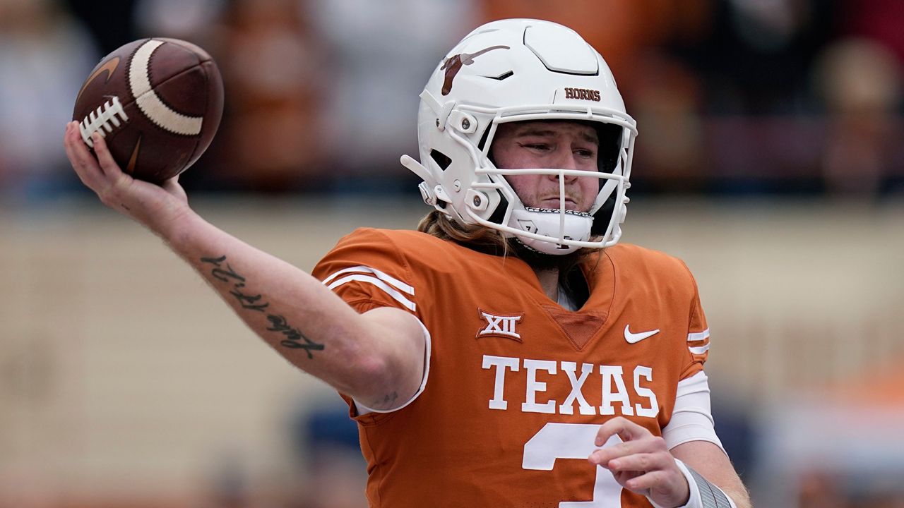 Texas quarterback Quinn Ewers looks to pass against Baylor during the first half of an NCAA college football game in Austin, Texas, Nov. 25, 2022. Texas opens their season at home against Rice on Sept. 2. (AP Photo/Eric Gay, File)