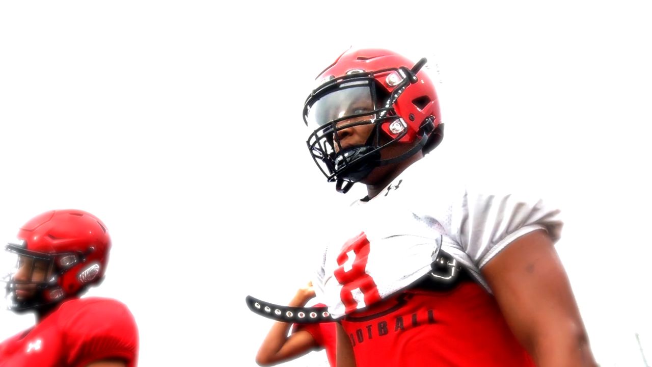 Manor Senior Running Back Quinten Joyner stands on the sideline during Mustangs practice. (Spectrum News 1/Victor Jaymes)