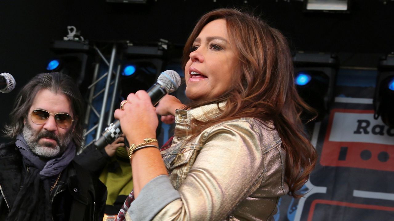 Rachael Ray, right, introduces her husband John Cusimano's band The Cringe onstage at her annual Feedback Party at Stubb's during the South by Southwest Music Festival on Saturday, March 16 2019, in Austin, Texas. (Photo by Jack Plunkett/Invision/AP)