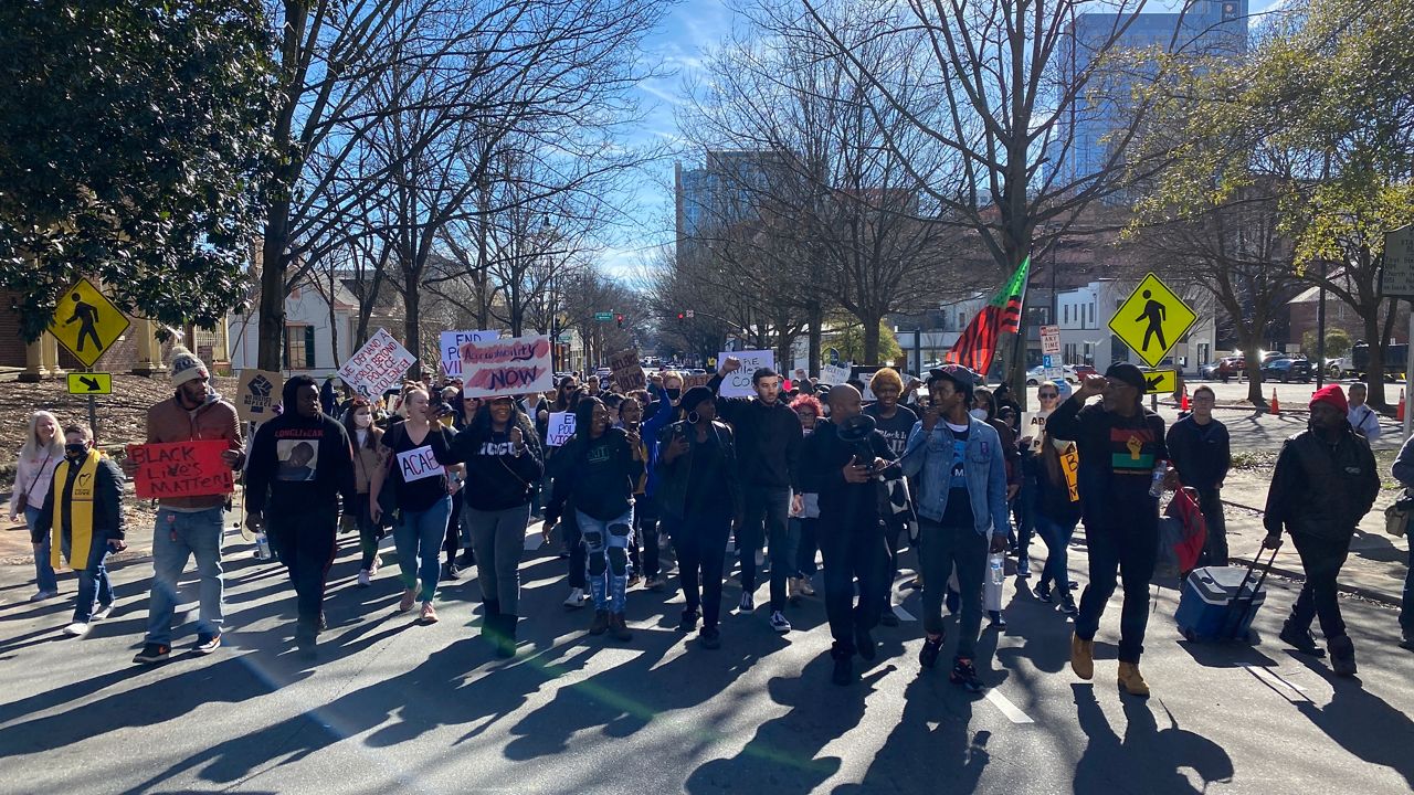 More than a hundred demonstrators march through downtown Raleigh to protest the deaths of Darryl Williams, who died in Raleigh police custody, and Tyre Nichols, who died after being beaten by police in Memphis. (Spectrum News 1/Charles Duncan)