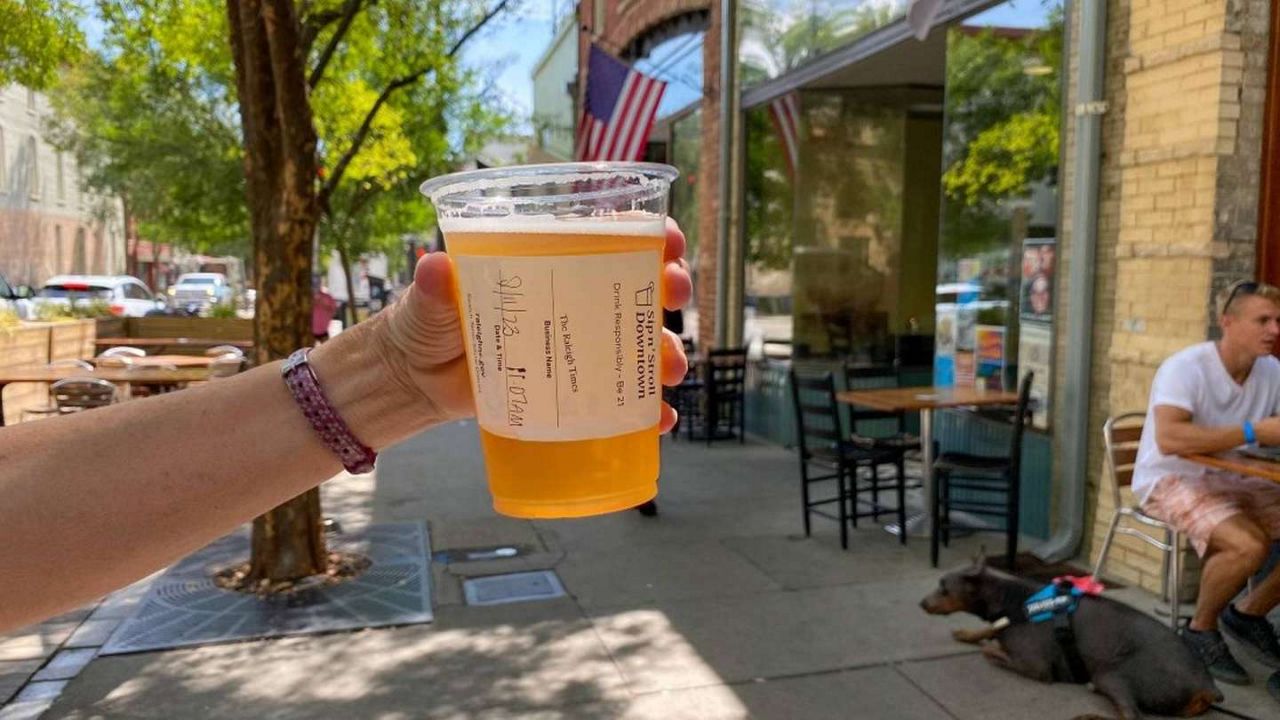 Sip n' Stroll in Downtown Raleigh allows people to stroll through the city with their beer, wine, or cocktail. The social district has been in place since August 2022. (Photo courtesy RaleighNC)