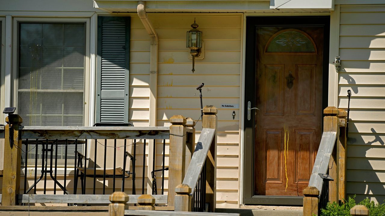 Dried egg is seen Monday on the front of a house where 16-year-old Ralph Yarl was shot Thursday after he went to the wrong address to pick up his younger brothers in Kansas City, Mo. (AP Photo/Charlie Riedel)