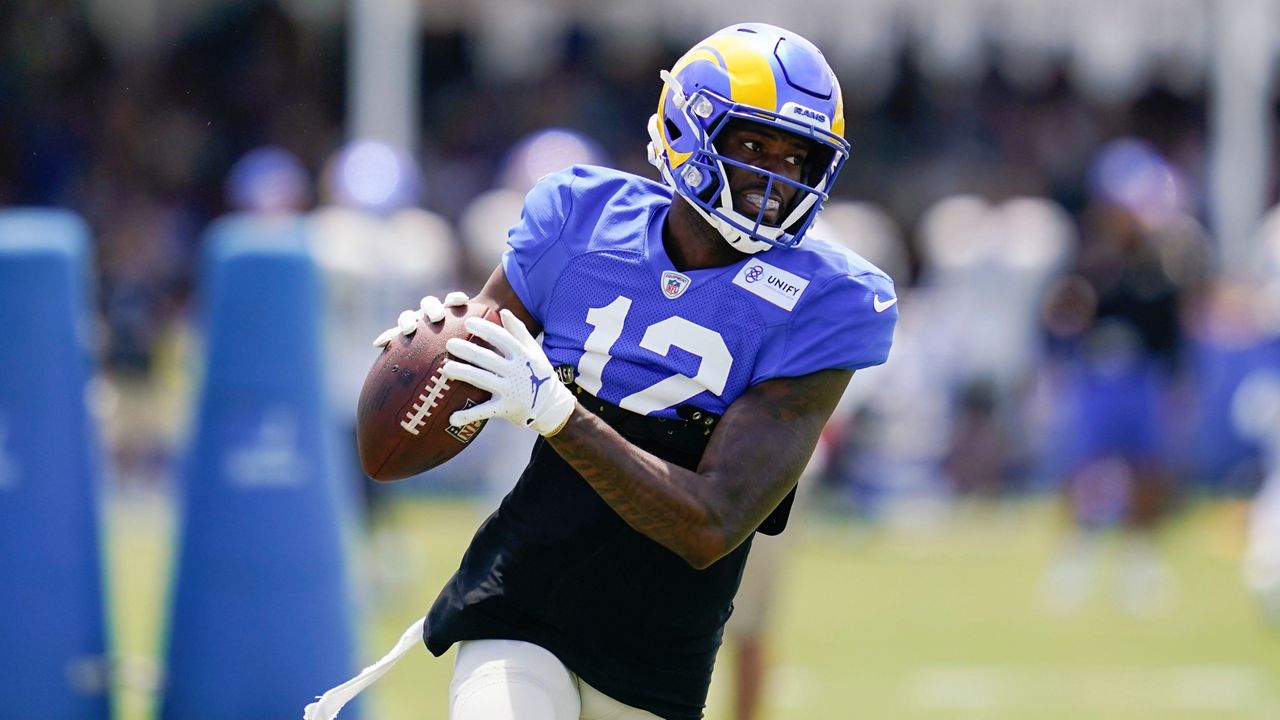 Los Angeles Rams wide receiver Van Jefferson (12) participates in drills at the NFL football team's practice facility in Irvine, Calif. Friday, July 29, 2022. (AP Photo/Ashley Landis)