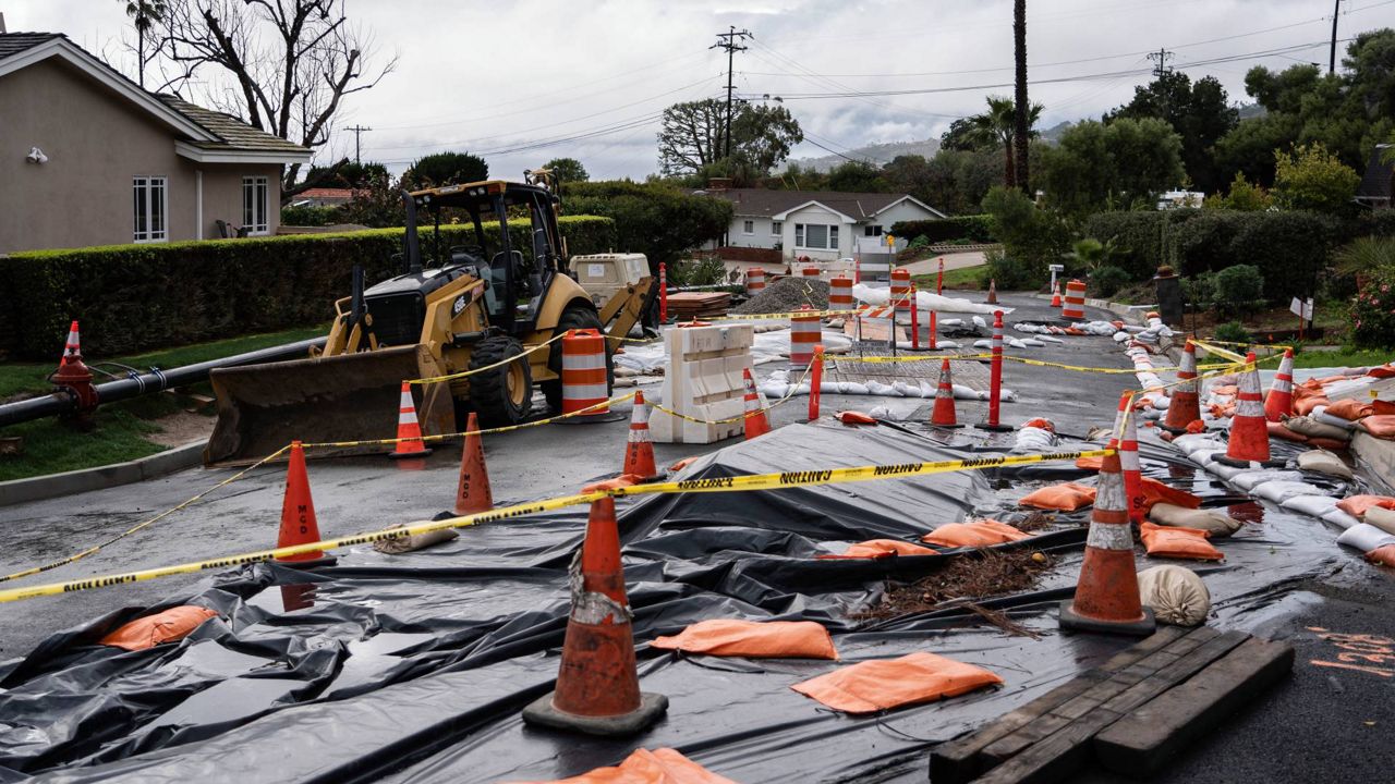 Caution tape closes off streets due to land movement intensified by recent storms in Rancho Palos Verdes, Calif. (AP Photo/Jae C. Hong)