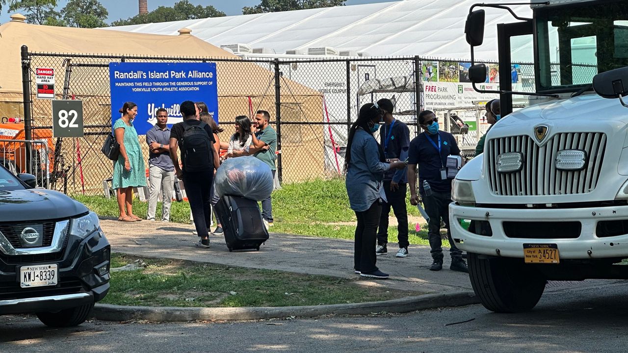 Migrants arrived at the Randall's Island site Sunday. (Spectrum News NY1/Tyler Buesching)
