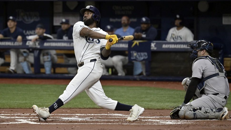 New York Yankees catcher Austin Wells, right, watches as Tampa Bay Rays' Randy Arozarena, left, hits a two-run home run off Yankees starter Nestor Cortes during the first inning of a baseball game Thursday, July 11, 2024, in St. Petersburg, Fla. (AP Photo/Steve Nesius)