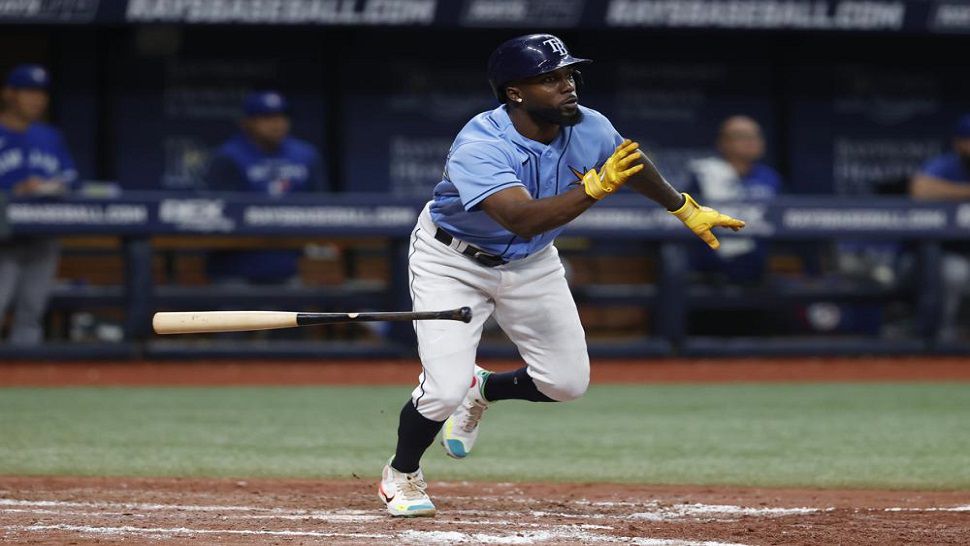 Tampa Bay Rays left fielder Randy Arozarena covers his eye with a ball  during an American League Division Series baseball practice Wednesday, Oct.  6, 2021, in St. Petersburg, Fla. The Rays play