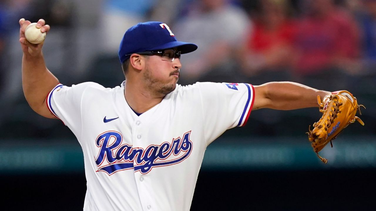 Texas Rangers starting pitcher Dane Dunning throws during the first inning of the team's baseball game against the Chicago White Sox in Arlington, Texas, Saturday, Aug. 6, 2022. (AP Photo/LM Otero)