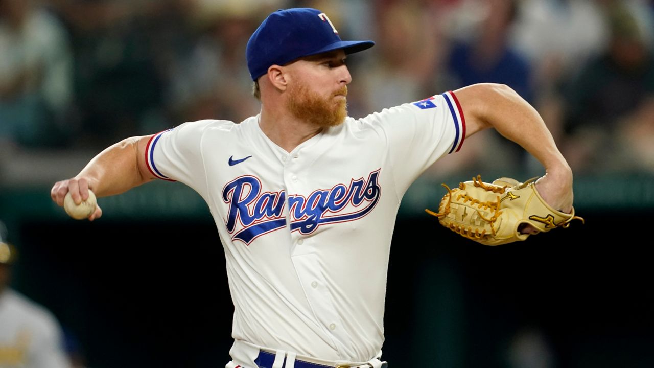 Texas Rangers starting pitcher Jon Gray throws to the Oakland Athletics in the fourth inning of a baseball game, Wednesday, July 13, 2022, in Arlington, Texas. (AP Photo/Tony Gutierrez)