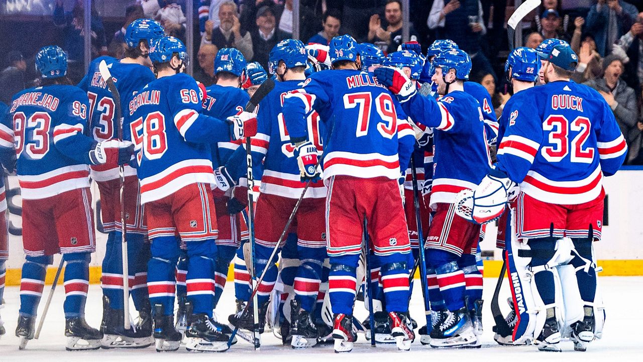 The Rangers gather on the ice after Adam Fox's overtime goal against the Philadelphia Flyers on Tuesday, March 26, 2024 in New York.
