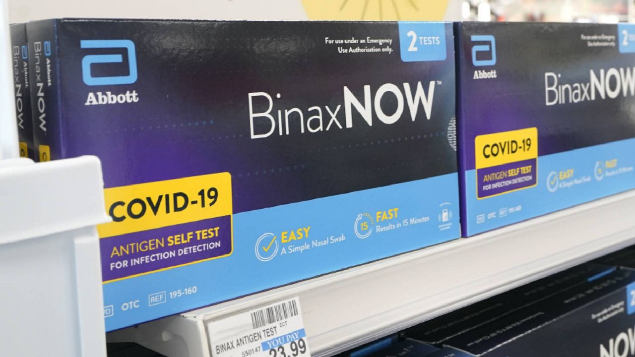 FILE - Boxes of BinaxNow home COVID-19 tests made by Abbott are shown for sale Monday, Nov. 15, 2021, at a CVS store in Lakewood, Wash., south of Seattle. (AP Photo/Ted S. Warren)