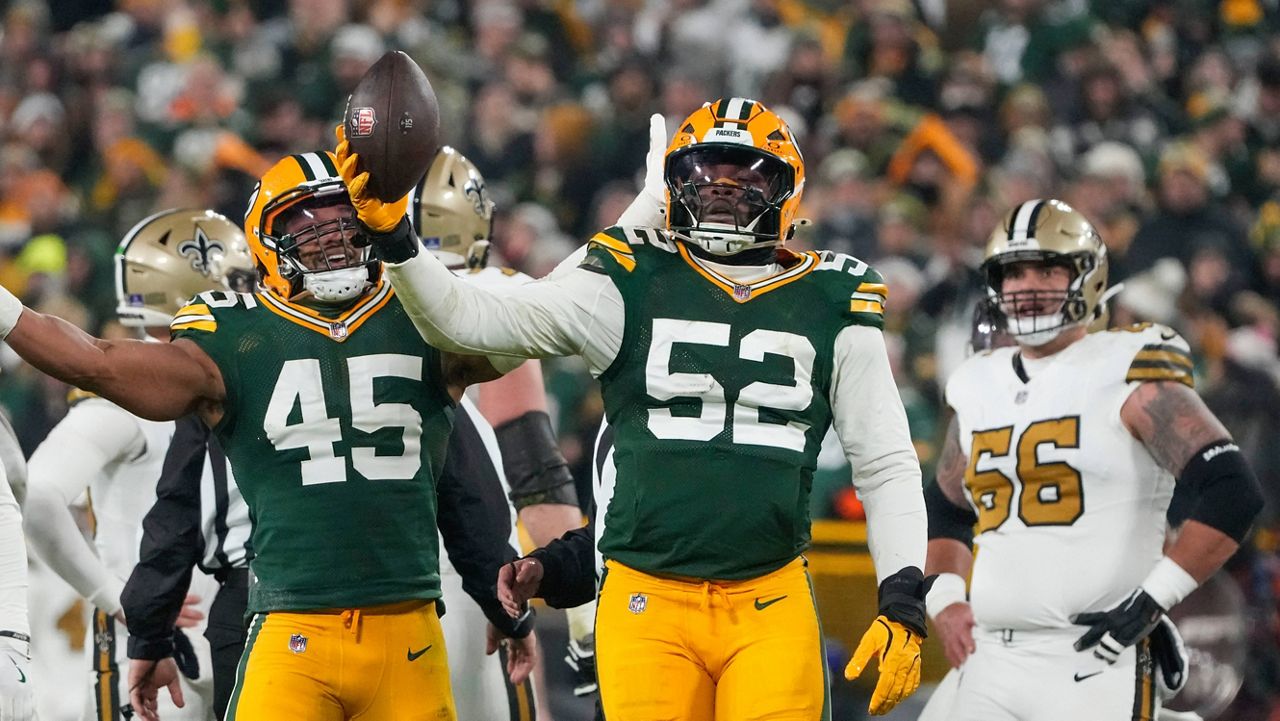 Green Bay Packers defensive end Rashan Gary (52) celebrates a fumble recovery 