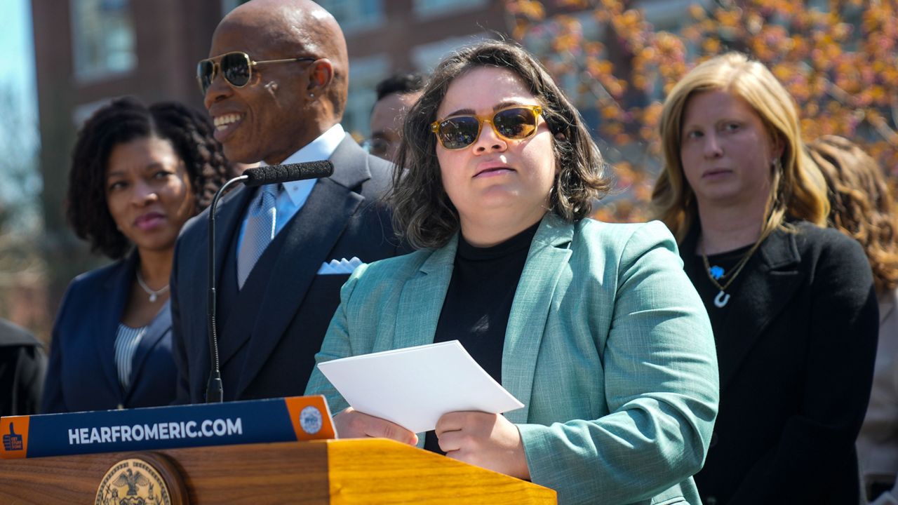 Eric Adams and Kathleen Corradi are pictured during a press conference in Harlem on Wednesday, April 12, 2023.