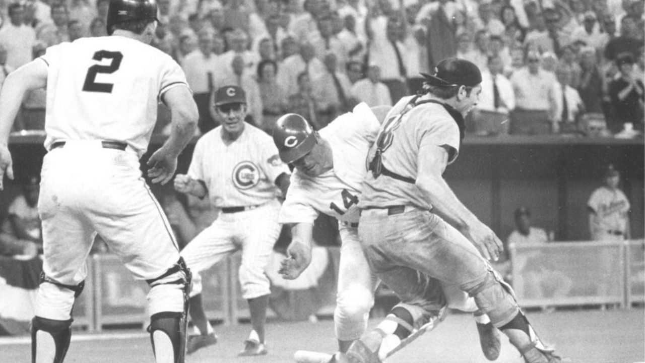 FILE - In this July 14, 1970, file photo, National League's Pete Rose slams into American League catcher Ray Fosse to score the winning run during the 12th inning of the baseball All-Star Game in Cincinnati. Looking on are third base coach Leo Durocher, and on-deck batter Dick Dietz (2). Fosse, the strong-armed catcher whose career was upended when he was bowled over by Rose in the All-Star Game, has died. He was 74. Carol Fosse, his wife of 51 years, said in a statement Fosse died Wednesday, Oct. 13, 2021, after a 16-year bout with cancer. (AP Photo, File)