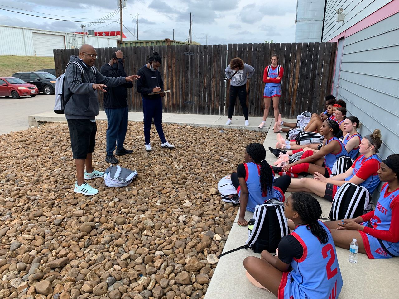 Coach Ray Caldwell confers with his players in this image from 2021. (Spectrum News 1/Adam Rossow)