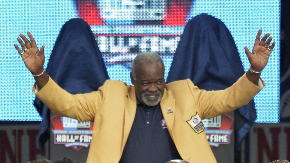 Rayfield Wright is introduced during the Pro Football Hall of Fame enshrinement ceremony Aug. 2, 2014, in Canton, Ohio. Wright, the Pro Football Hall of Fame offensive tackle nicknamed “Big Cat” who went to five Super Bowls in his 13 NFL seasons with the Dallas Cowboys, has died. He was 76. Wright's family confirmed his death Thursday, April 7, 2022, to the Pro Football Hall of Fame. (AP Photo/David Richard, File)