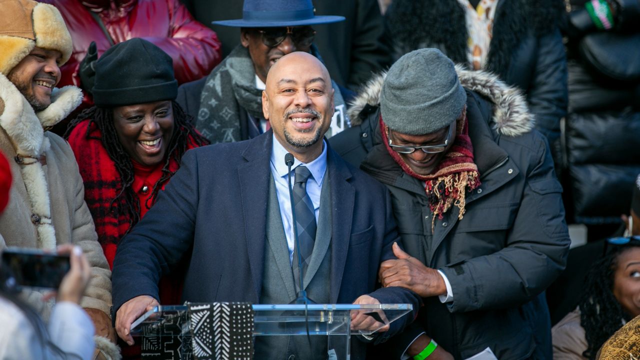 Raymond Santana speaks at the unveiling of the Gate of the Exonerated along a Central Park perimeter wall on Monday, December 19, 2022. (AP Photo/Ted Shaffrey)