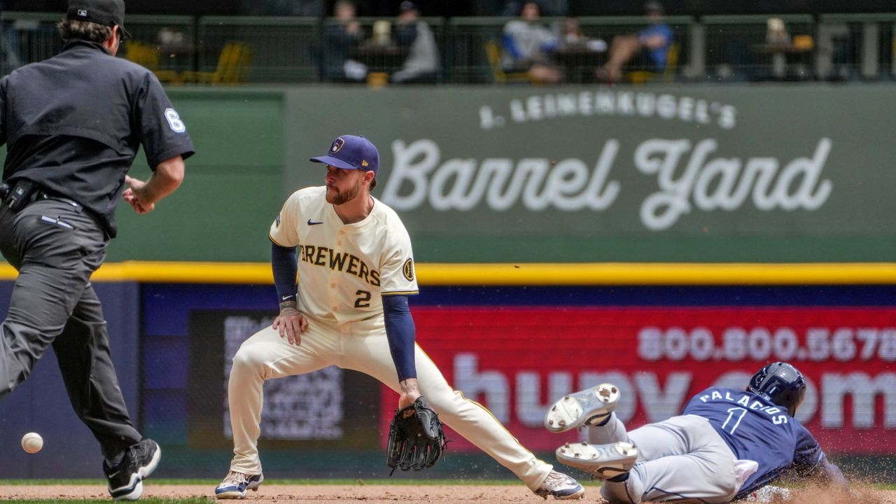 Tampa Bay's Richie Palacios steals 2nd base as Milwaukee Brewers' Brice Turang reaches for the late throw in the 5th inning on Wednesday, May 1, 2024, in Milwaukee. (AP Photo/Kenny Yoo)