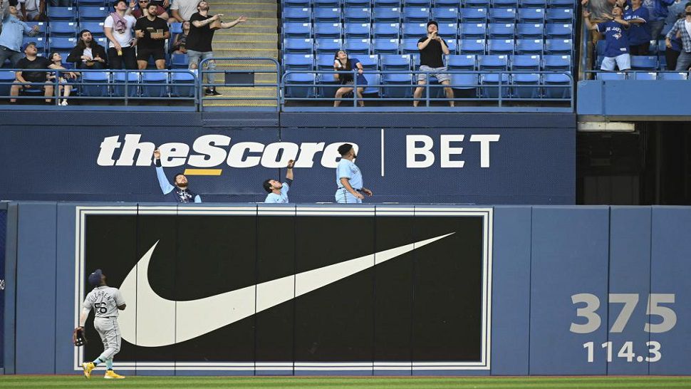 Tampa Bay Rays left fielder Randy Arozarena and members of the Toronto Blue Jays bullpen watch a two-run home run by Blue Jays' Teoscar Hernandez during the second inning of a baseball game Thursday, June 30, 2022, in Toronto. (Jon Blacker/The Canadian Press via AP)