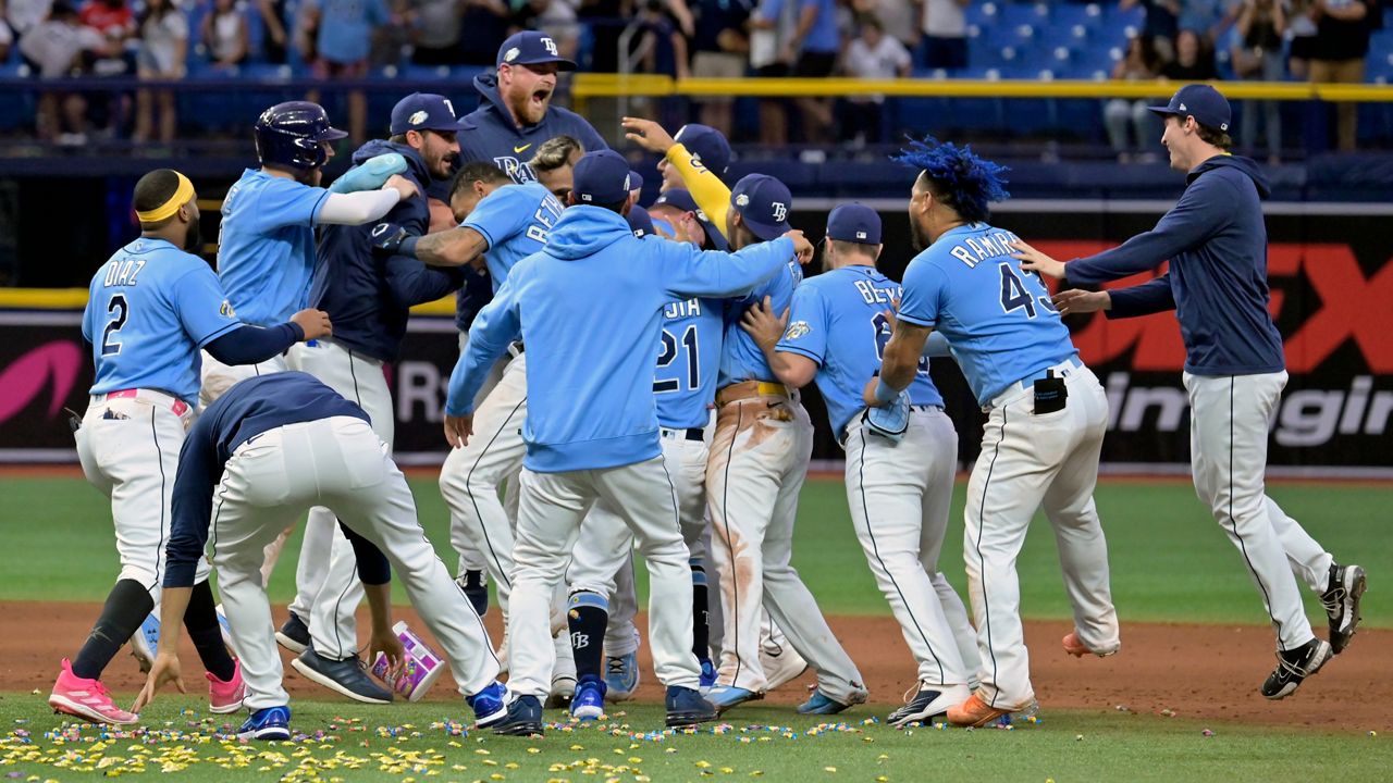 Tampa Bay Rays celebrate a 8-7 win over the New York Yankees during the tenth inning of a baseball game Sunday, May 7, 2023, in St. Petersburg, Fla. (AP Photo/Steve Nesius)