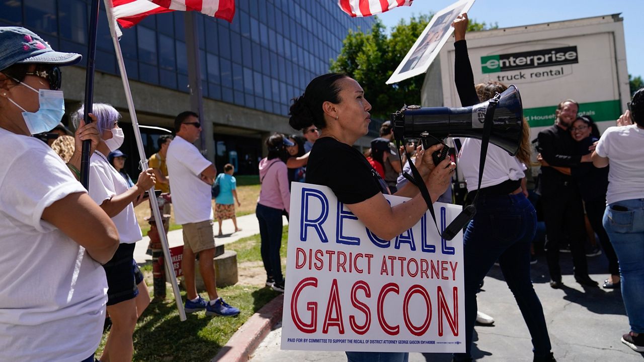 Supporters of a campaign to recall Los Angeles County District Attorney George Gascon gather to view a truck full of petitions outside the Los Angeles County Registrar of Voters on Wednesday, July 6, 2022, in Norwalk, Calif. (AP Photo/Ashley Landis)