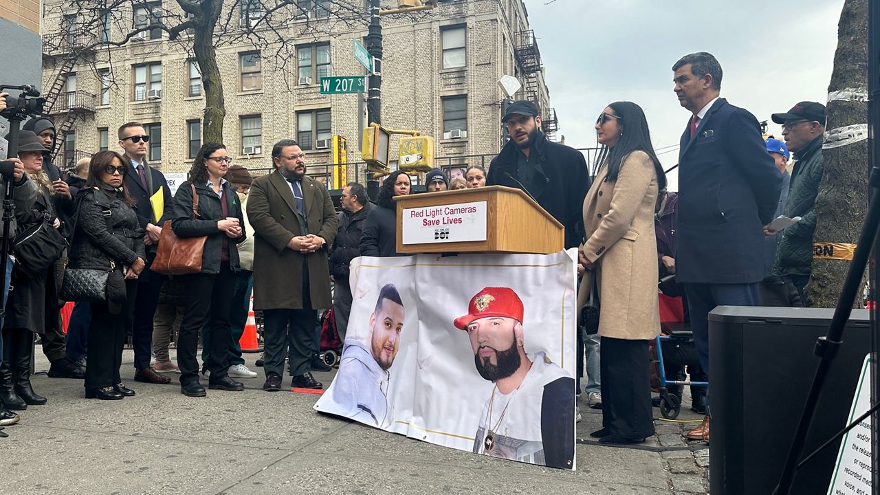 The families of two men killed in August 2022 by a speeding car that ran a red light in Inwood are calling on Albany lawmakers to renew and expand the red light camera program to save other families from their grief. (Spectrum News NY1/Samantha Liebman)