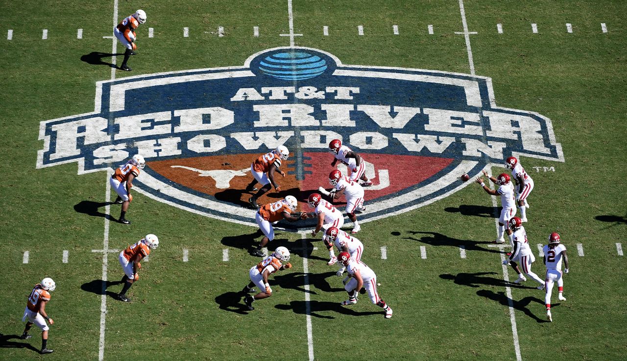 FILE - Oklahoma, right, runs a play against Texas in the first half of an NCAA college football game at the Cotton Bowl in Dallas, Oct. 12, 2019. The Big 12 is losing its marquee matchup when the Red River Rivalry is played Saturday for the final time under the league’s umbrella. (AP Photo/Jeffrey McWhorter, File)