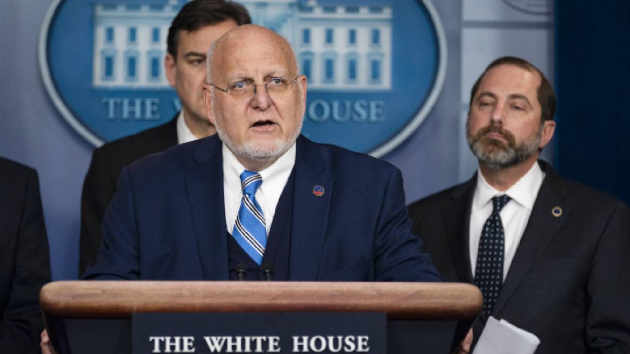 Director of the Centers for Disease Control and Prevention Dr. Robert Redfield speaks from the White House in January, joined by Secretary of Health and Human Services Alex Azar. (AP Photo/ Evan Vucci)