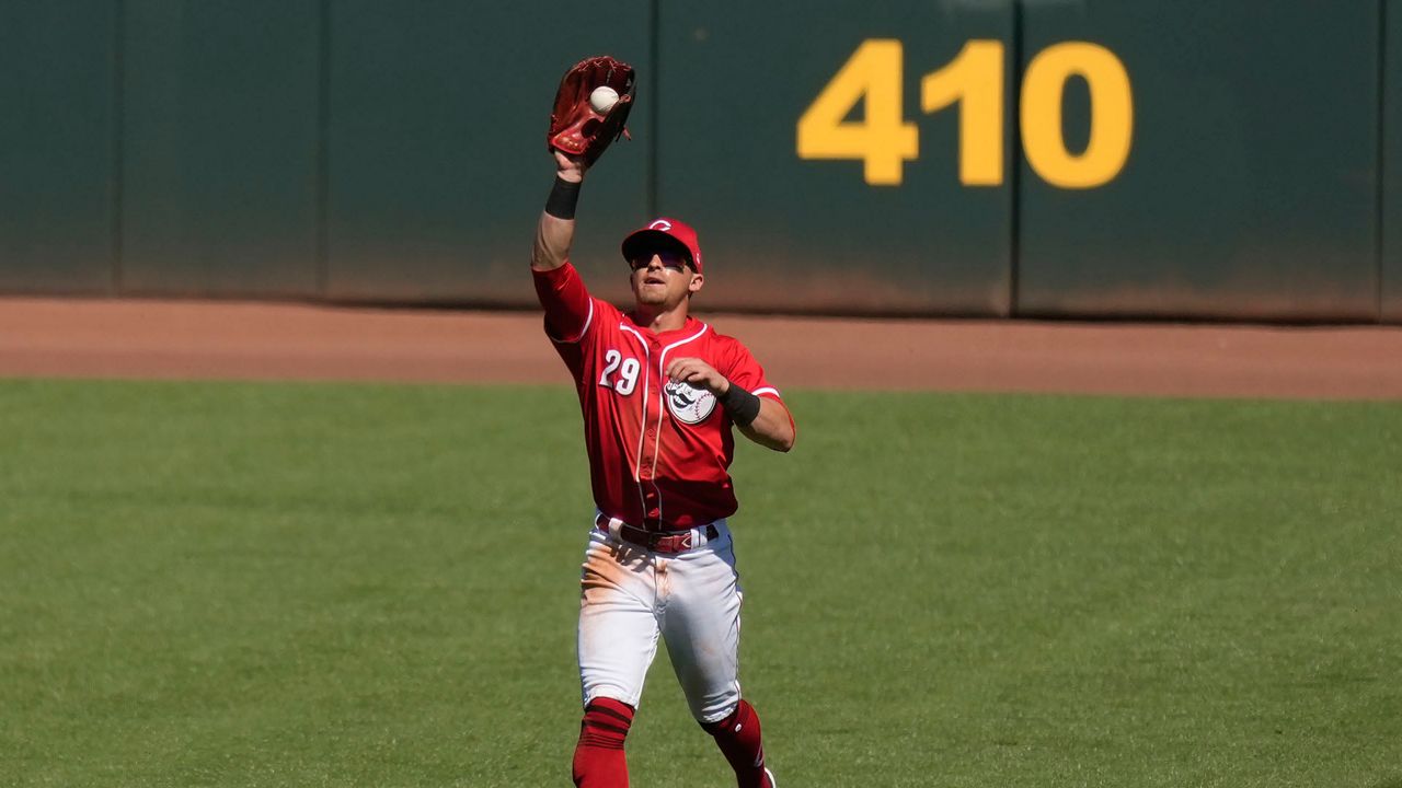 Cincinnati Reds center fielder TJ Friedl catches a fly ball. (AP Photo/Carolyn Kaster)