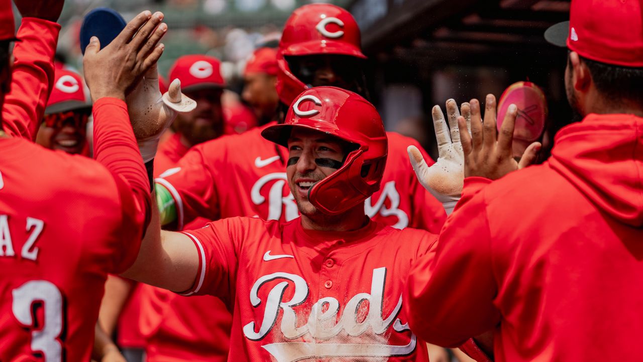 Cincinnati Reds outfielder Spencer Steer (7) celebrates in the dugout after scoring a run in the first inning of the first baseball game of a doubleheader against the Atlanta Braves, Wednesday, July 24, 2024, in Atlanta. 