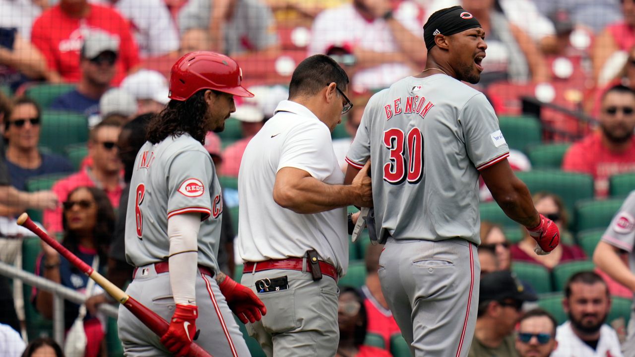 Cincinnati Reds' Will Benson (30) leaves the baseball game after being injured while batting during the sixth inning against the St. Louis Cardinals Thursday, Sept. 12, 2024, in St. Louis. 