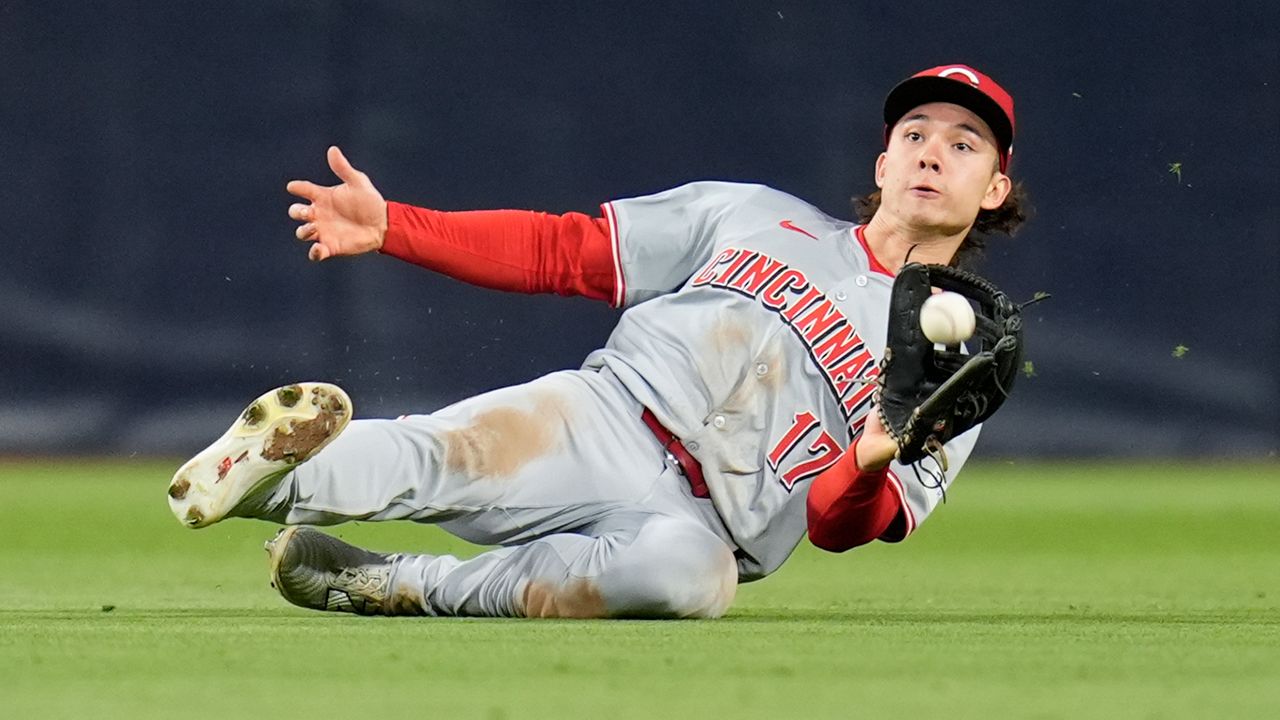Cincinnati Reds center fielder Stuart Fairchild makes a sliding catch for the out on San Diego Padres' Luis Campusano during the fourth inning of a baseball game, Tuesday, April 30, 2024, in San Diego. (AP Photo/Gregory Bull)