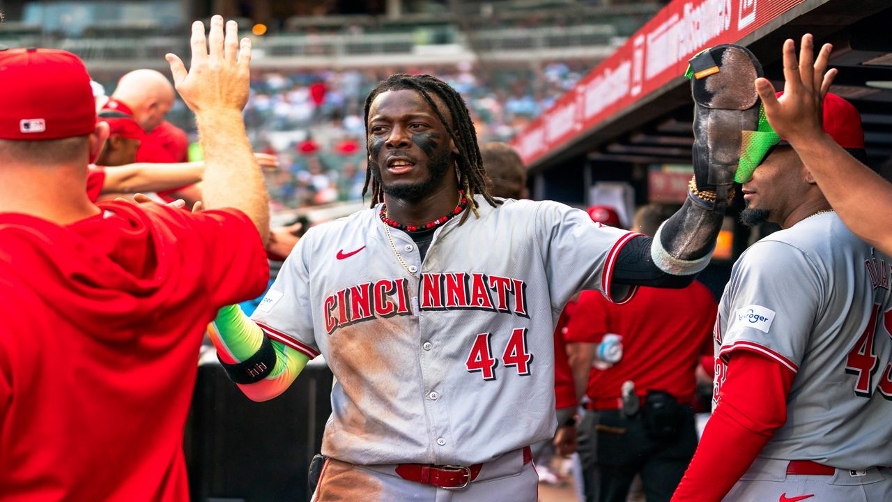 Cincinnati Reds' Elly De La Cruz (44) celebrates with teammates in the dugout after scoring in the first inning of a baseball game against the Atlanta Braves, Monday, July 22, 2024, in Atlanta. (AP Photo/Jason Allen)