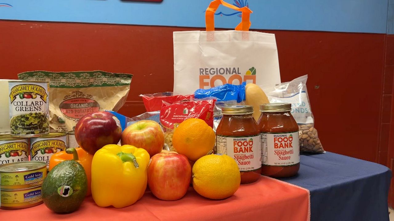 various vegetables and canned or jarred goods on a regional food bank table