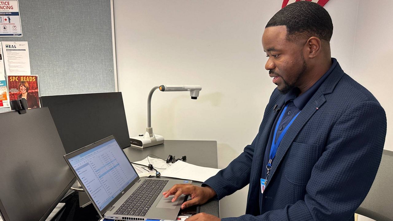 Remus Bulmer, St. Pete Collegiate STEM High School's academic program director, is one of only 28 recipients nationwide to receive a scholarship to attend the Shark Biology and Conservation Research Experience at the renowned Bimini Shark Lab in the Bahamas. (Spectrum News/Fallon Silcox)