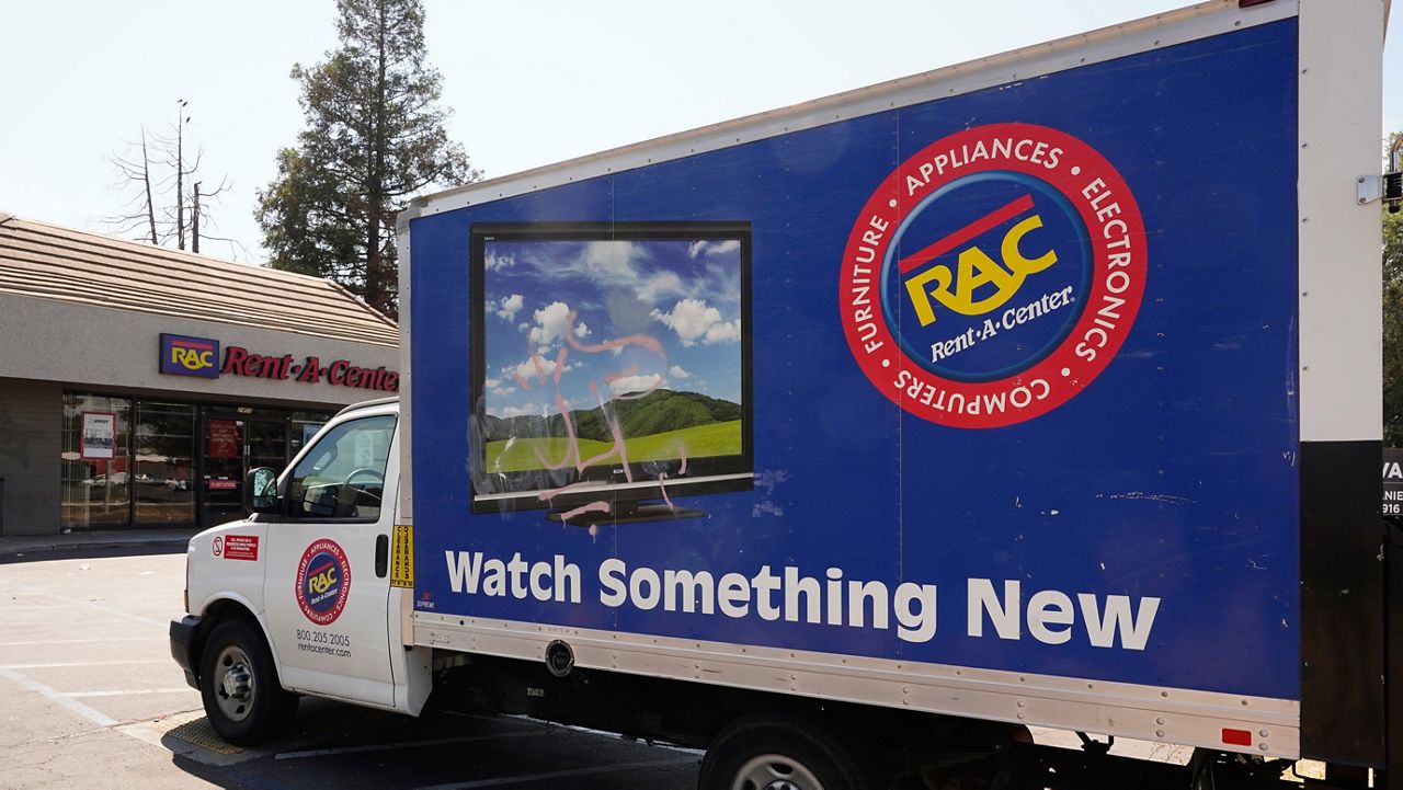 A Rent-A-Center delivery truck is seen in Sacramento, Calif., Tuesday, Aug. 2, 2022. (AP Photo/Rich Pedroncelli)