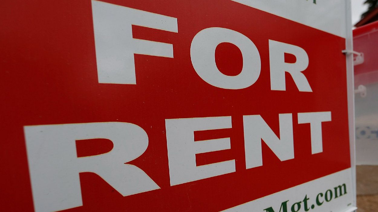 A photo of a sign indicating a property is for rent