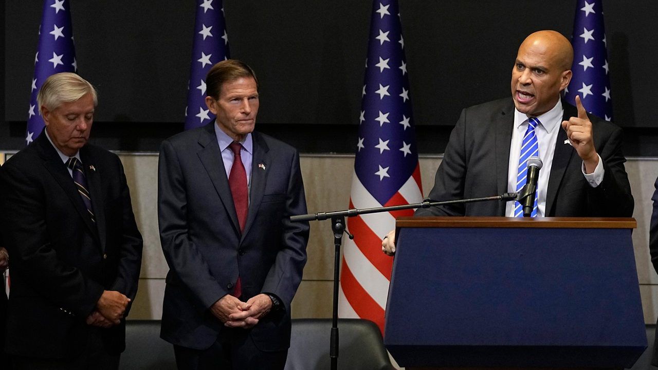 Sen. Lindsey Graham, R-S.C., left, and Sen. Richard Blumenthal, D-Conn., listen at a press conference in Tel Aviv, Sunday Oct. 22, 2023. (AP Photo/Ohad Zwigenberg)