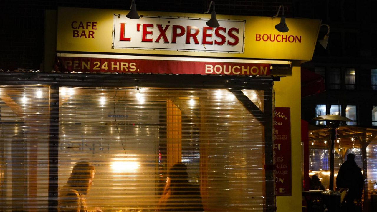 FILE - In this Feb. 13, 2021 file photo, people dine in at the restaurant L'Express in New York. (AP Photo/Frank Franklin II, File)