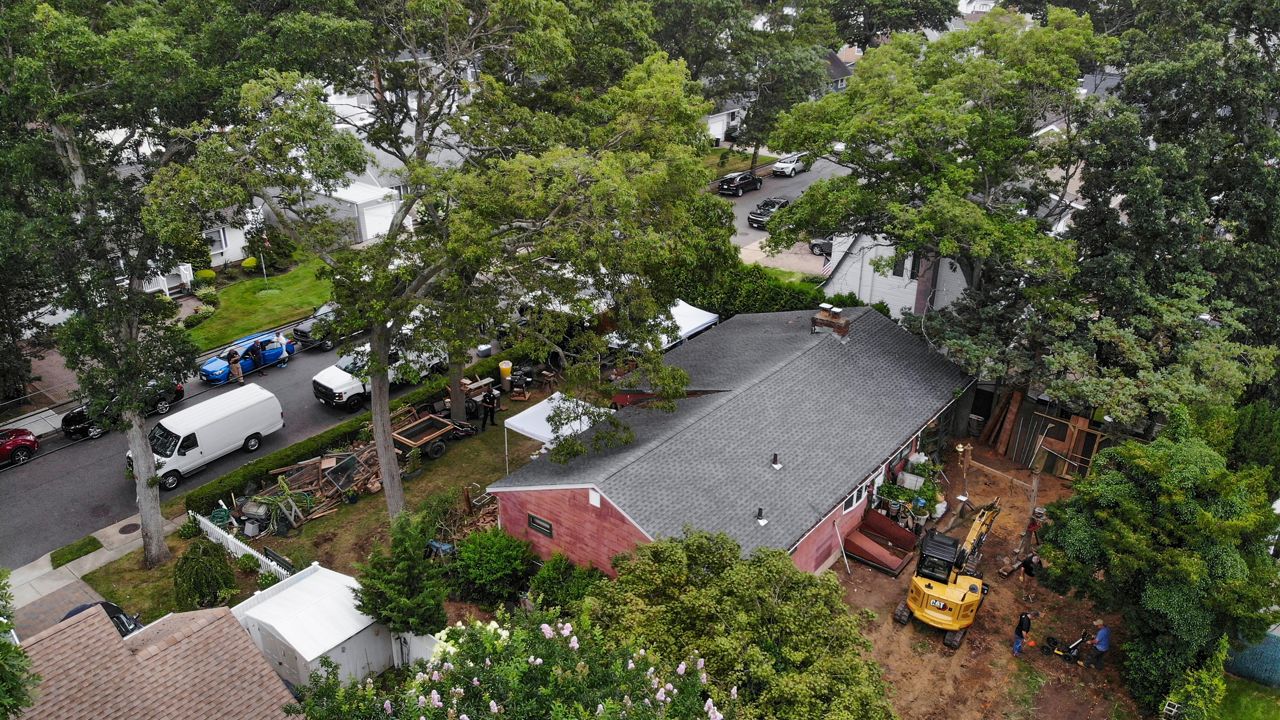 Authorities work at the home of suspect Rex Heuermann in Massapequa Park on Monday, July 24, 2023.