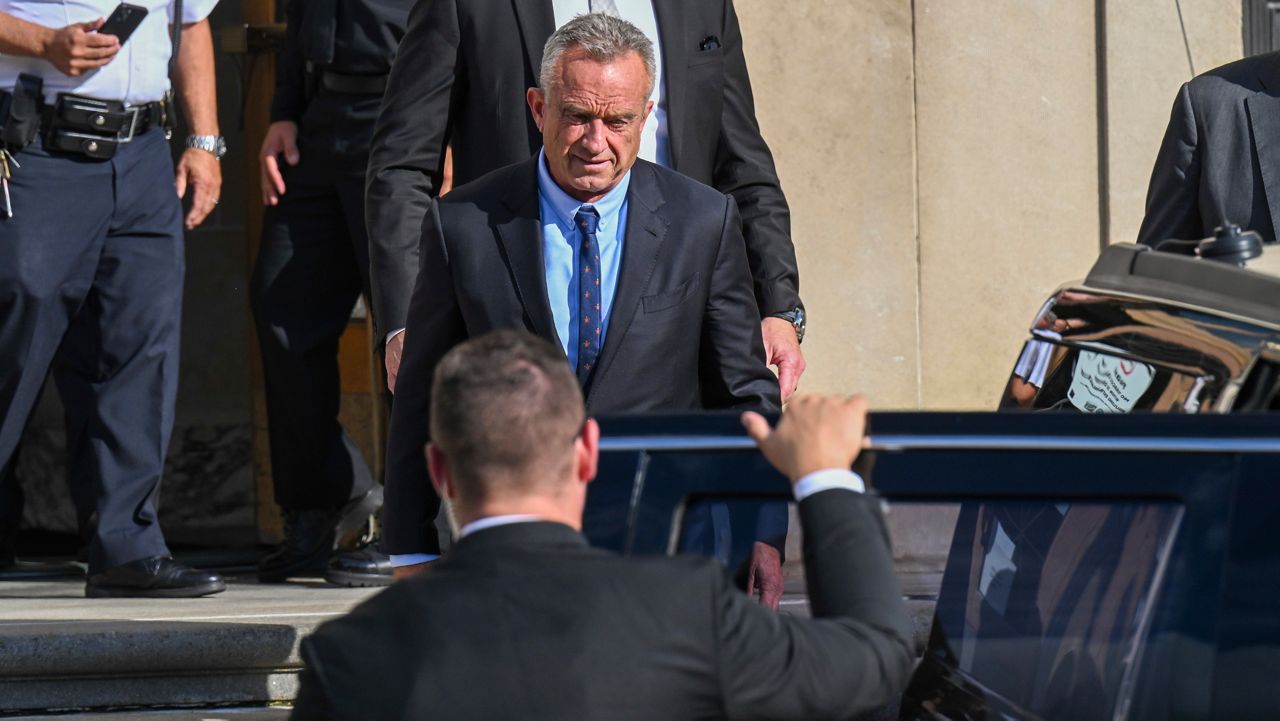 Independent presidential candidate Robert F. Kennedy Jr., top, leaves after giving testimony at the Albany County Courthouse, Aug. 7, 2024, in Albany, N.Y. (AP Photo/Hans Pennink, File)