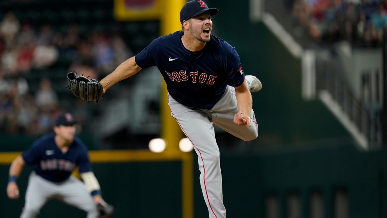 Boston Red Sox's Alex Cora makes a play during Game 1 of the