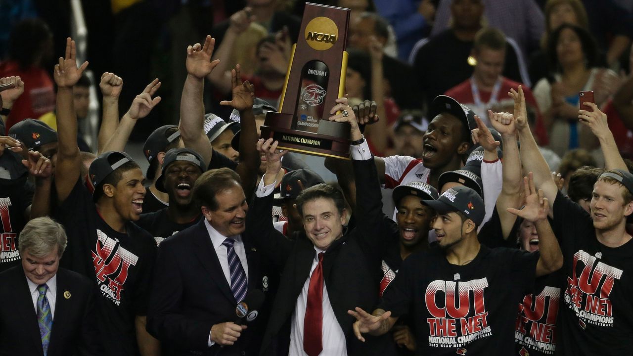 Louisville players and Rick Pitino celebrate after winning the national title on Monday, April 8, 2013 in Atlanta.